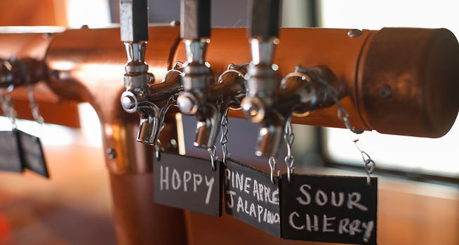 Close-up of beer taps and labels